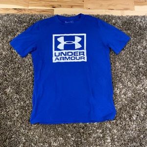 Blue Under Armour shirt.